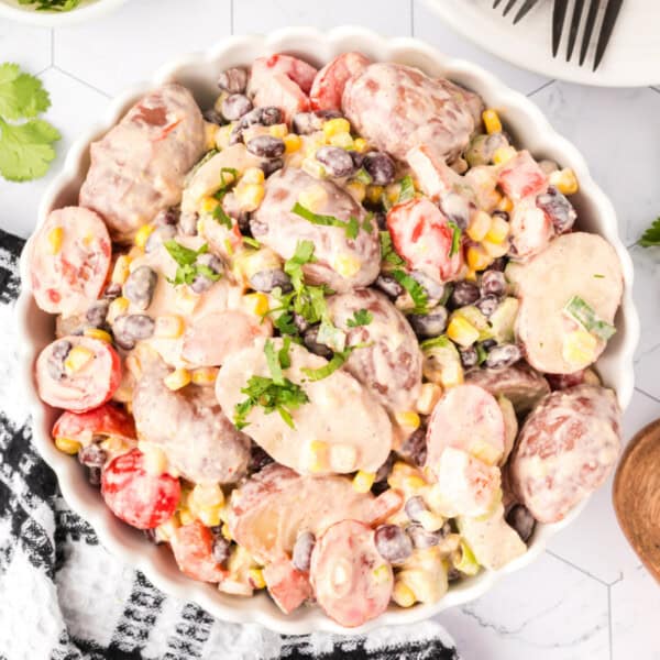 Overhead square image of Southwest Potato Salad served in a white dish, perfect for Pinterest.