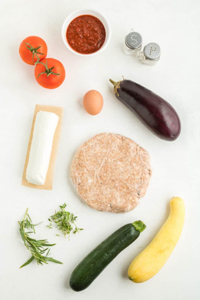 Ingredients for the vegetable galette filling including tomatoes, eggplant, zucchini, and goat cheese.