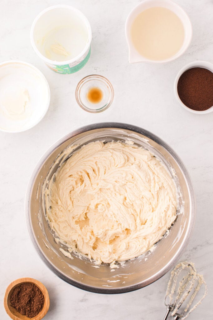 Bowl of creamy mascarpone frosting after mixing.
