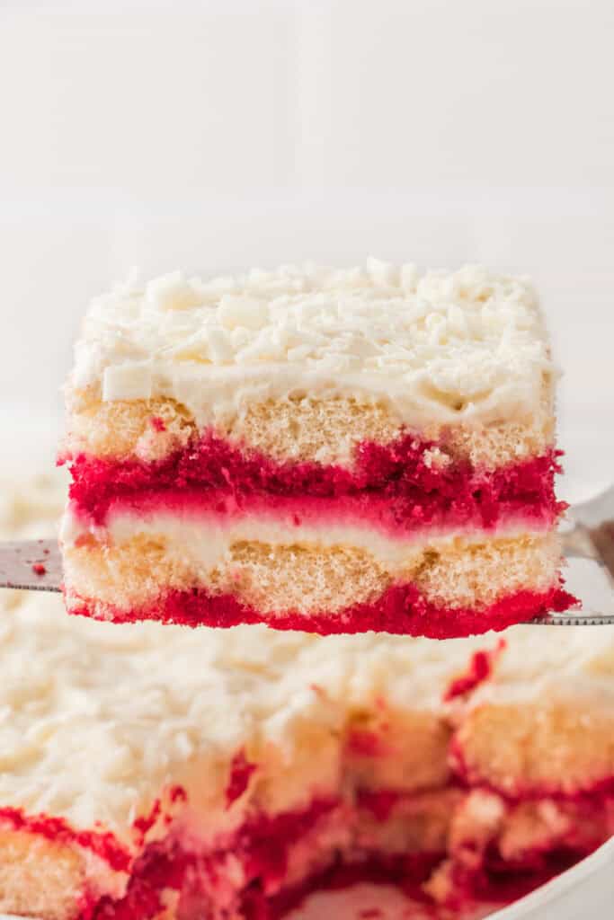 Close-up of a sliced piece of White Chocolate Raspberry Tiramisu showing perfect layers.