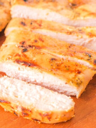 Square-cropped image of sliced grilled honey mustard chicken breast