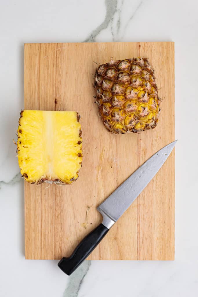 Pineapple cut in half showing juicy yellow interior