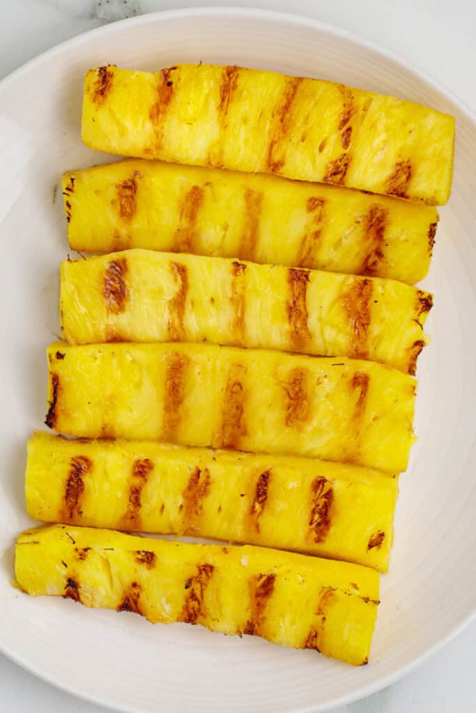 Close-up of grilled pineapple spears with caramelized grill marks