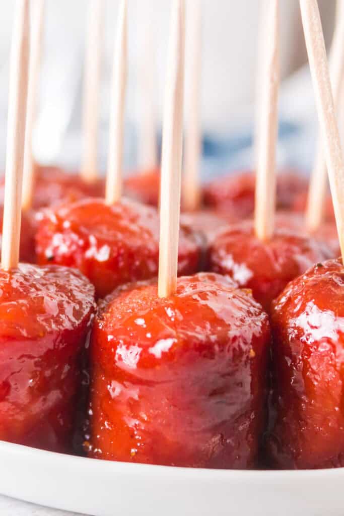 Finished hot dog burnt ends served with toothpicks on a platter, ready to eat