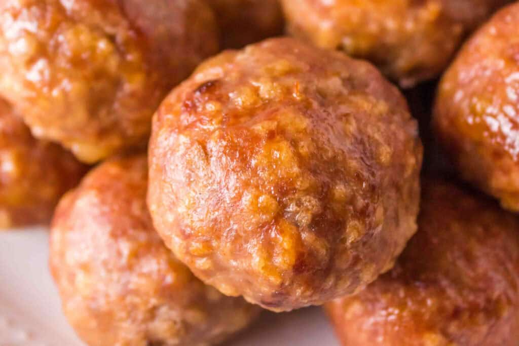 Close-up of fully smoked turkey meatballs with a golden brown exterior.