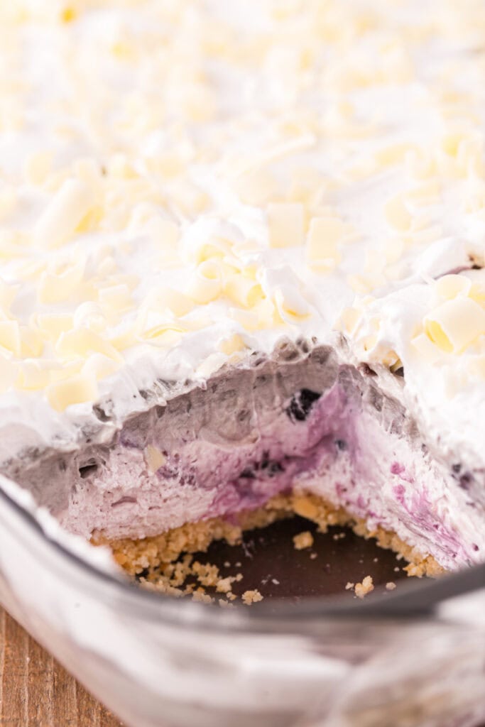 Close-up showing the layered dessert with a large scoop missing