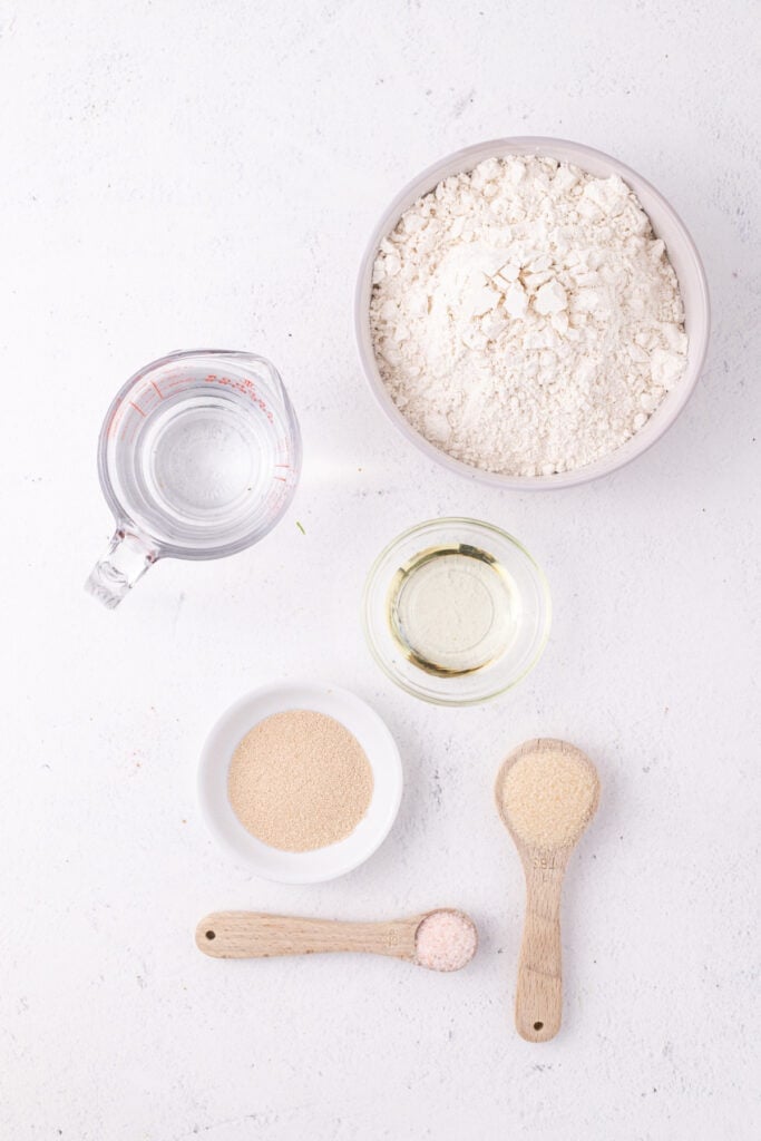 Ingredients for bread in a bag recipe including flour, yeast, sugar, salt, oil, and water
