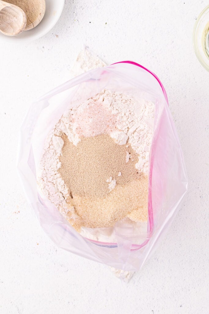 Dry ingredients added to a Ziploc bag for bread in a bag recipe