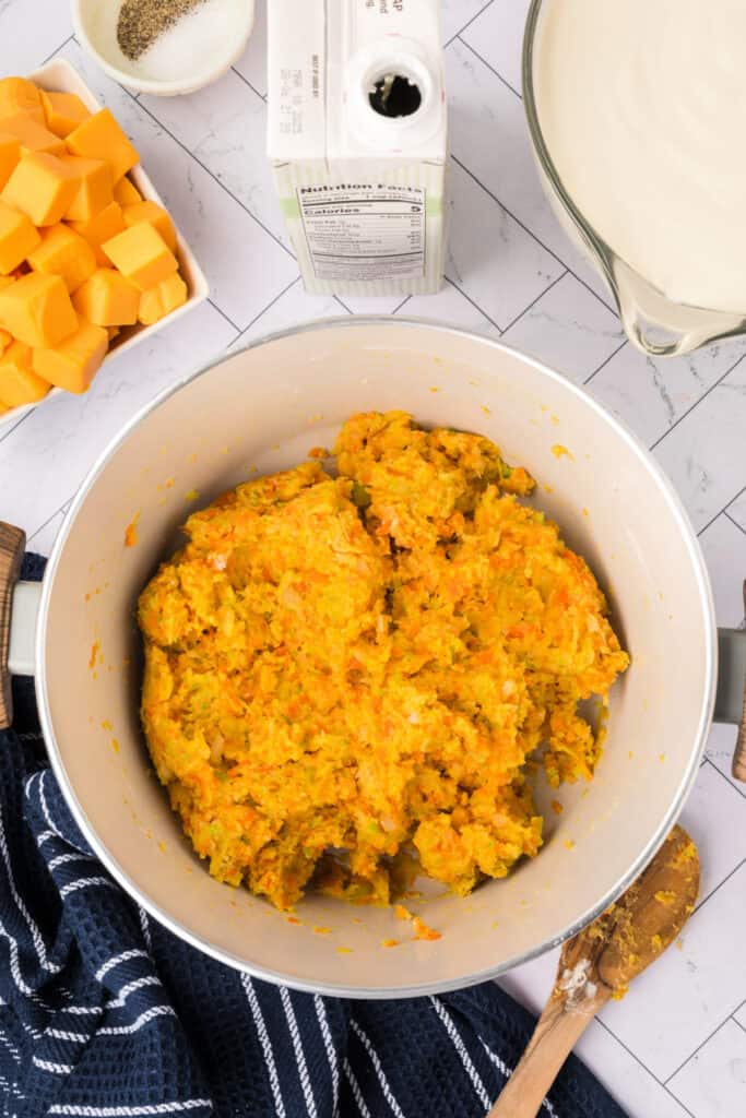Roux formed with vegetables and flour after stirring, creating a thick base mixture.