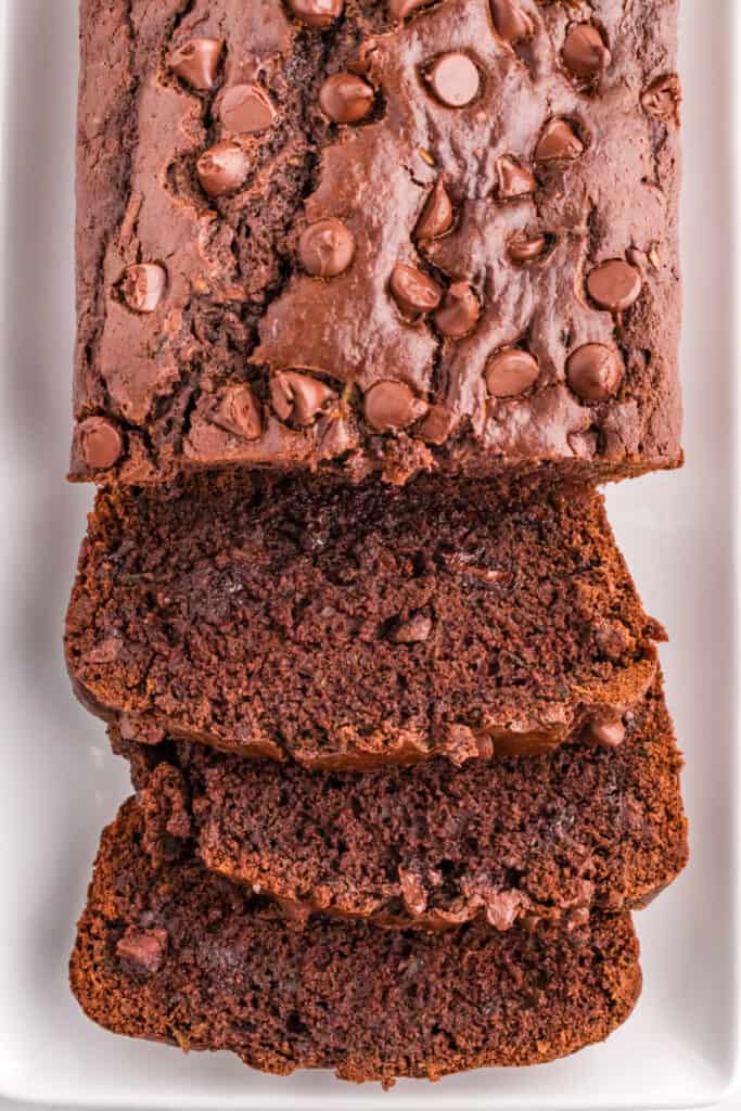 Sliced double chocolate zucchini bread showing moist and rich chocolate interior.