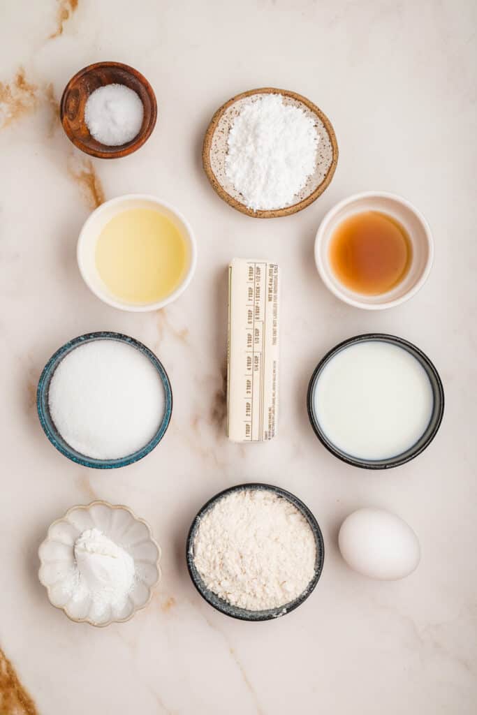 Overhead view of all measured ingredients for glazed doughnut holes