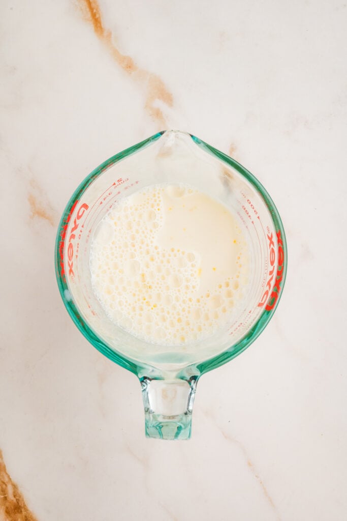 Milk, egg, and vanilla mixture lightly whisked in a measuring cup