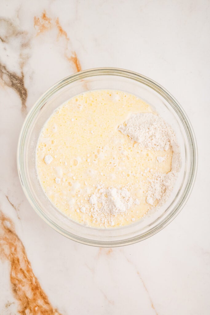 Wet ingredients poured into dry ingredients before mixing