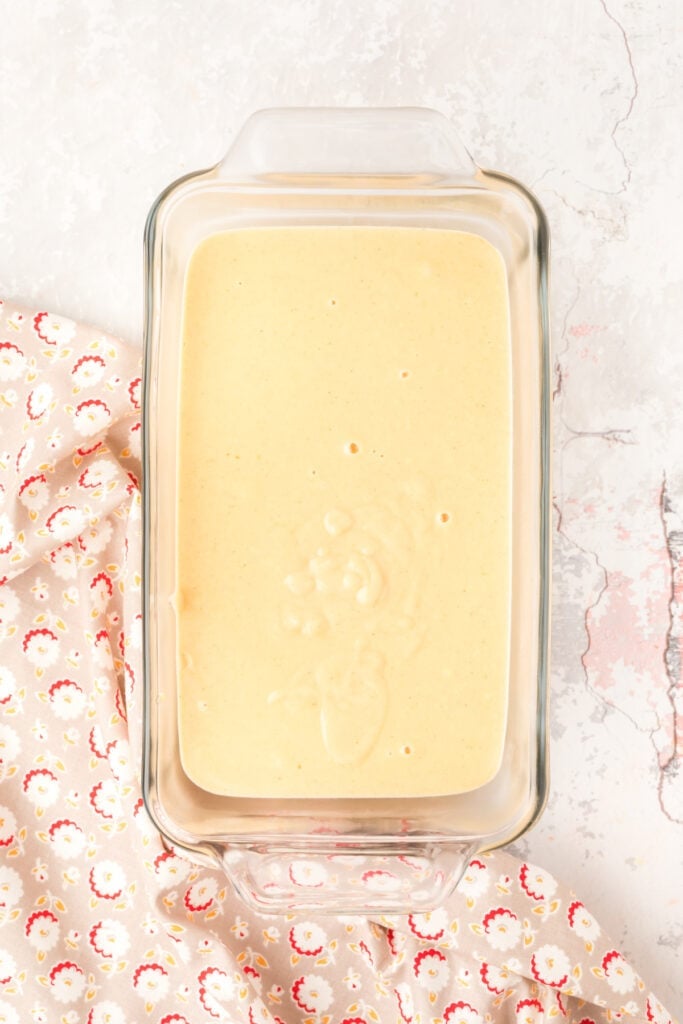 	Peanut butter ice cream custard base poured into a glass container to chill before churning.