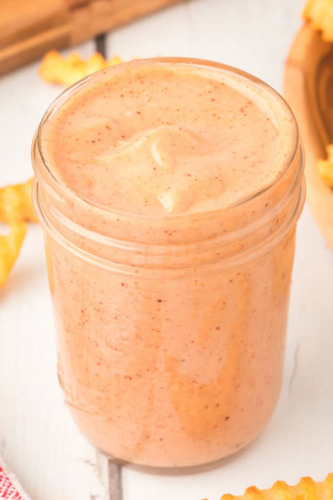 Mason jar filled with creamy homemade Campfire Sauce
