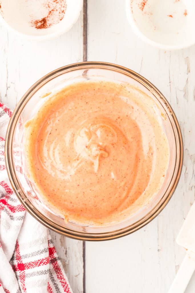 Fully mixed Campfire Sauce in a glass bowl, ready to chill