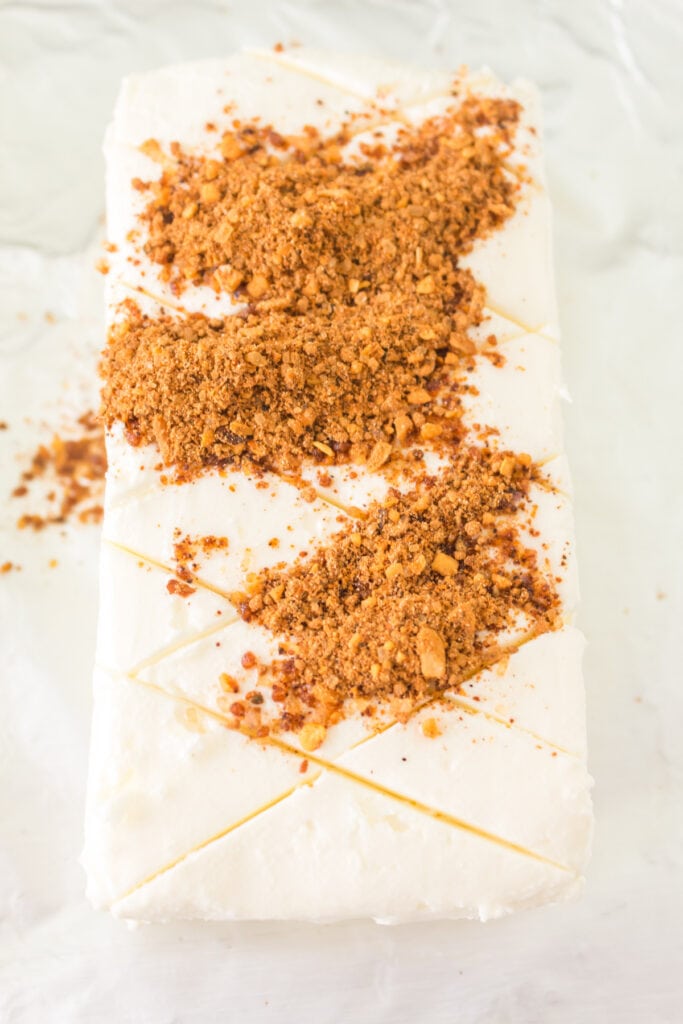 Scored cream cheese topped with a generous layer of BBQ rub