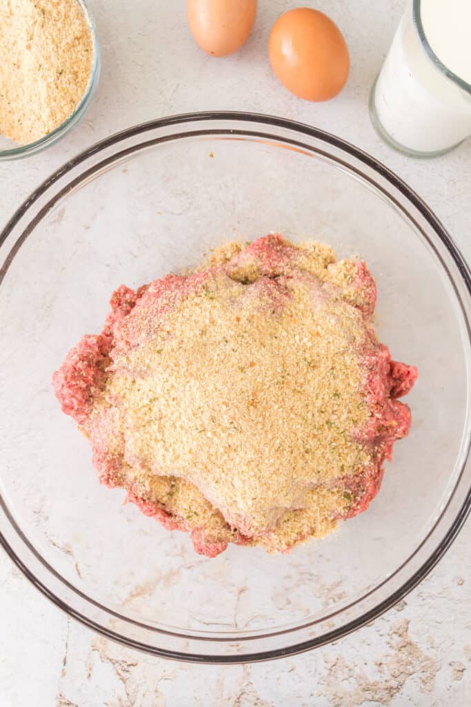 Italian breadcrumbs added to the seasoned ground beef mixture