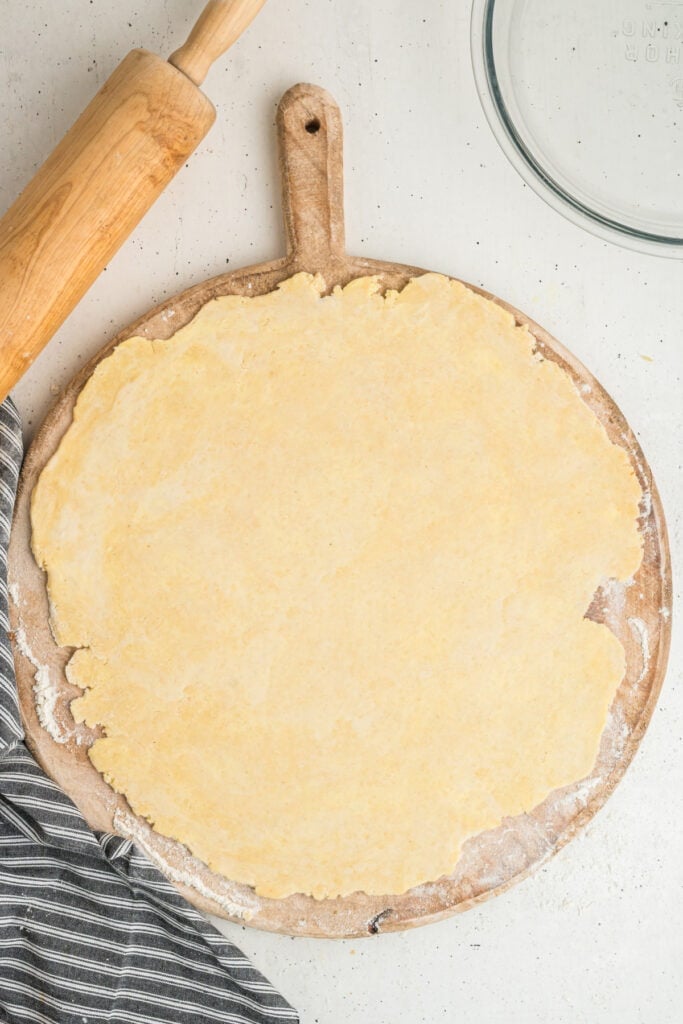 Rolled out butter pie crust dough ready to be transferred to pie dish