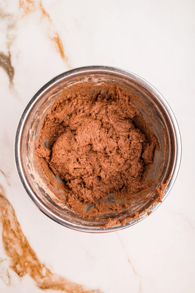 Fully mixed chocolate donut dough ready to scoop