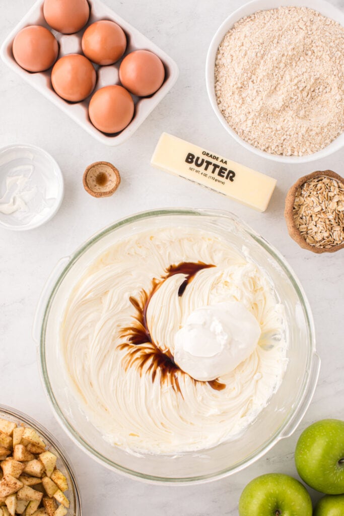 Cream cheese mixture with sour cream and vanilla extract added on top.