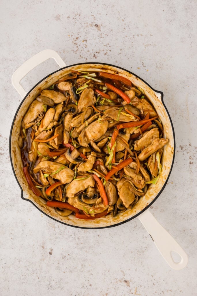 Chicken added back to skillet with vegetables and sauce