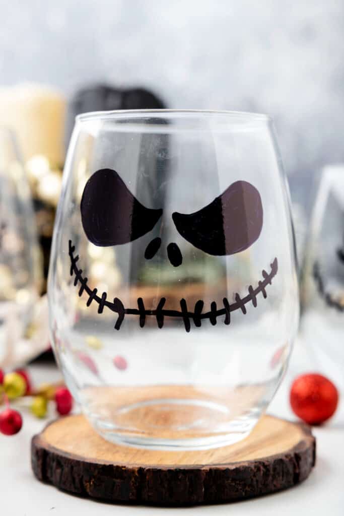 A Jack Skellington glass with a more serious expression, featuring angled eyes and stitched grin.