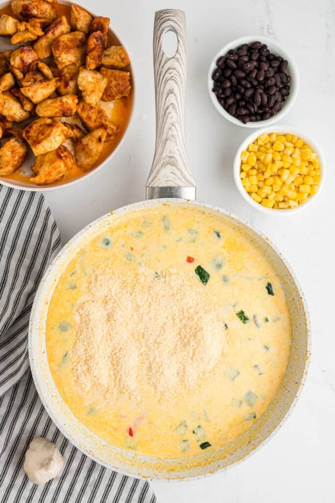 Grated parmesan sprinkled into the creamy southwest alfredo sauce.