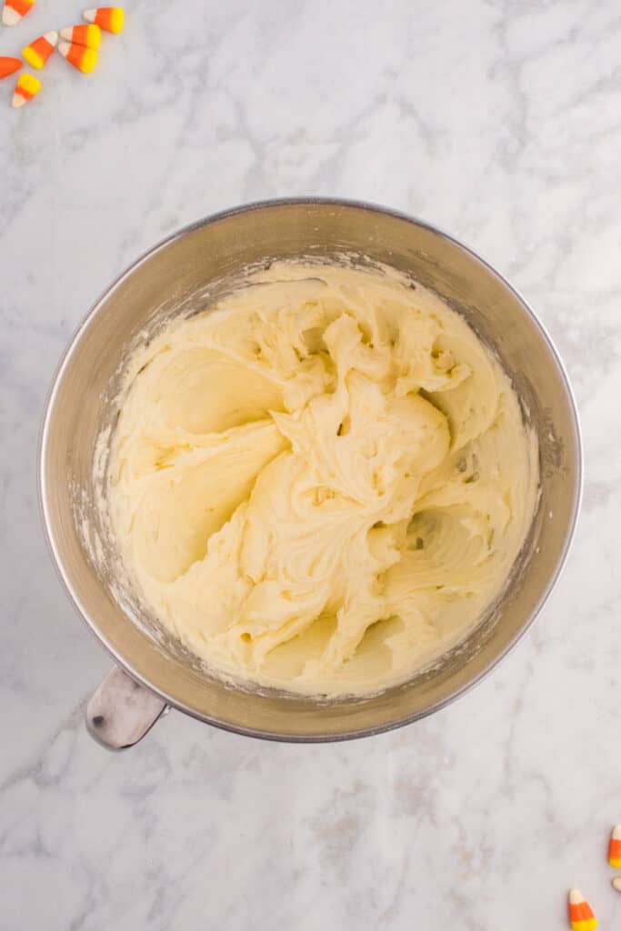 Smooth and fluffy white frosting fully mixed and ready for piping.