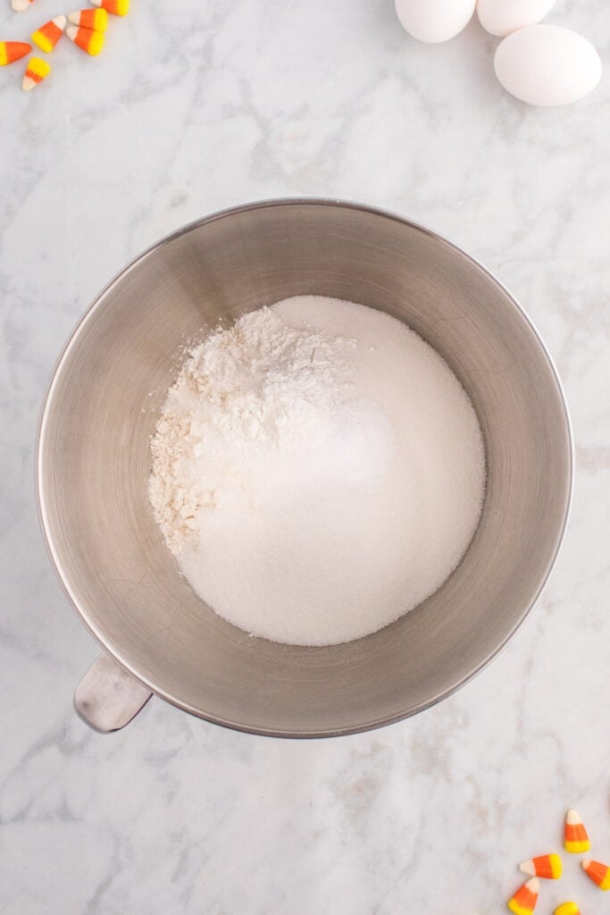 Mixing bowl filled with flour, sugar, and leavening ingredients before combining with wet ingredients.