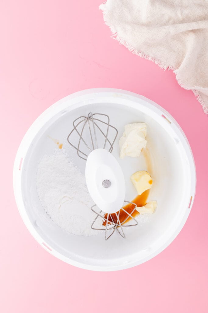 Butter, cream cheese, powdered sugar, and vanilla extract in a mixing bowl for frosting