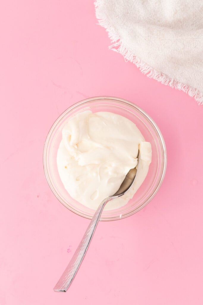 Cream cheese frosting mixed until smooth in a small bowl