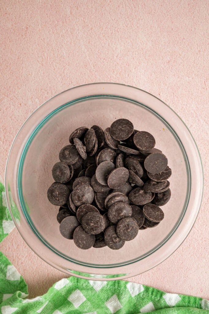 chocolate melting wafers in a clear glass bowl