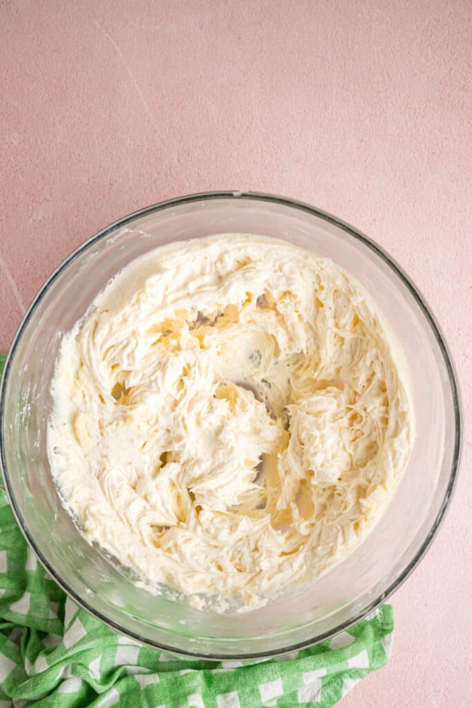 smooth and fluffy buttercream filling in a glass mixing bowl