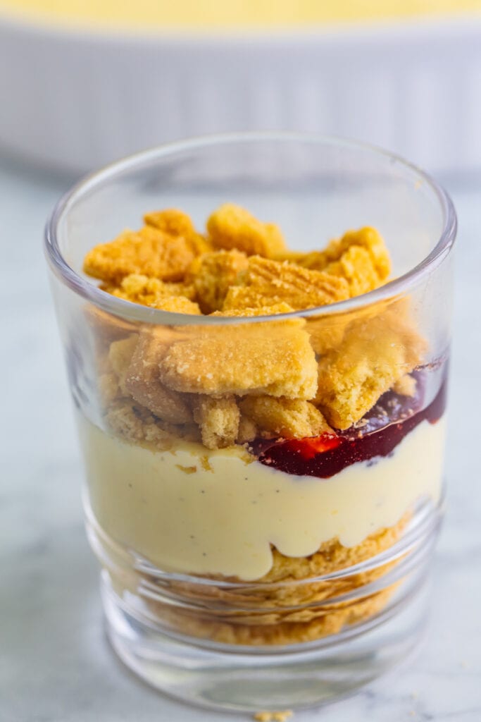 crushed shortbread cookies added as a layer over custard and jam