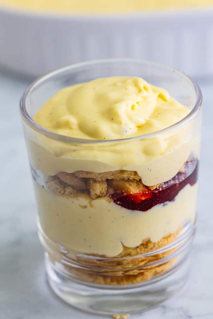 vanilla custard smoothed on top of layered creme brulee trifle