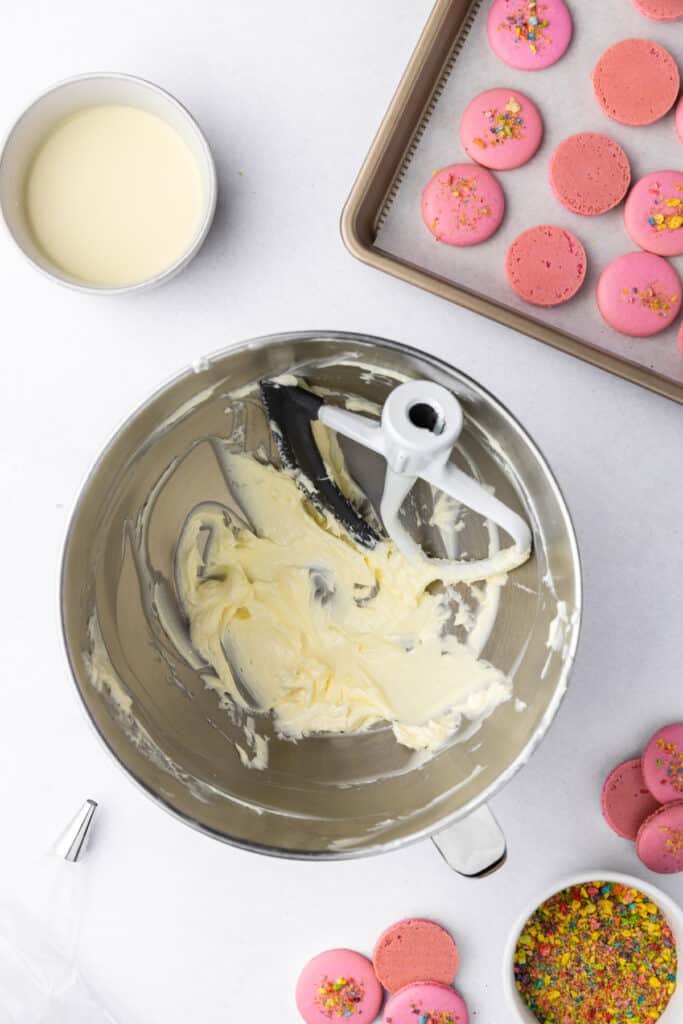 buttercream base in a stand mixer bowl before adding powdered sugar
