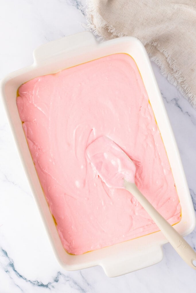 unbaked cake batter in a rectangle baking dish ready to be baked