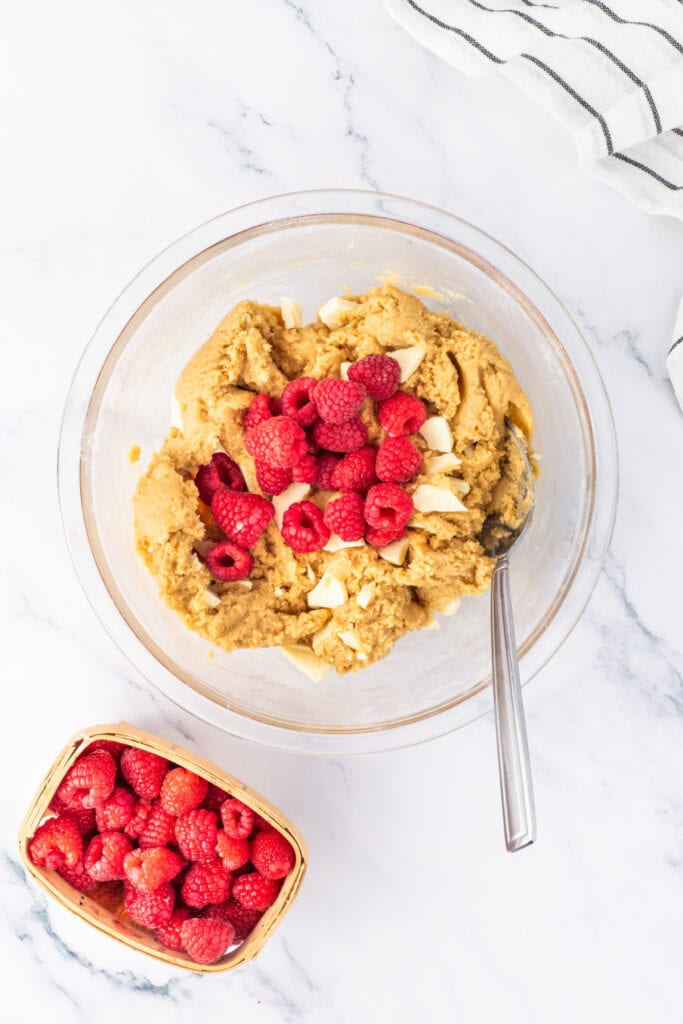 Fresh raspberries folded into white chocolate blondie batter