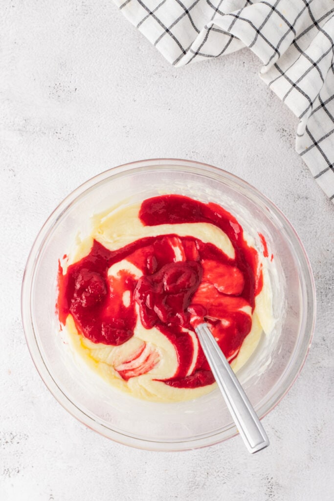 Raspberry puree swirled into white chocolate fudge mixture