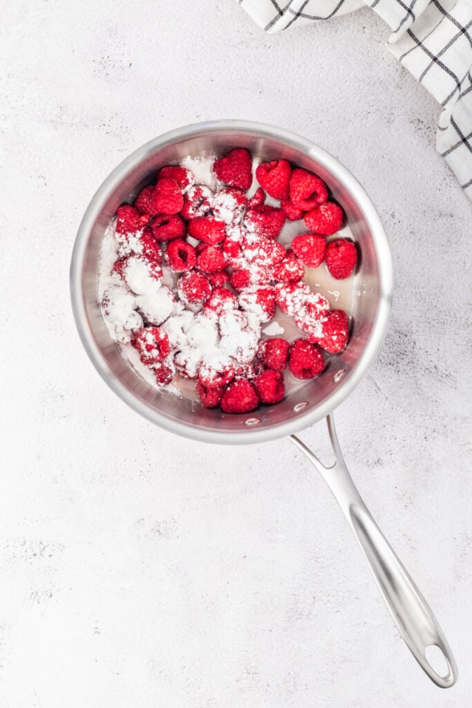 Fresh raspberries tossed with cornstarch and lemon juice in a saucepan