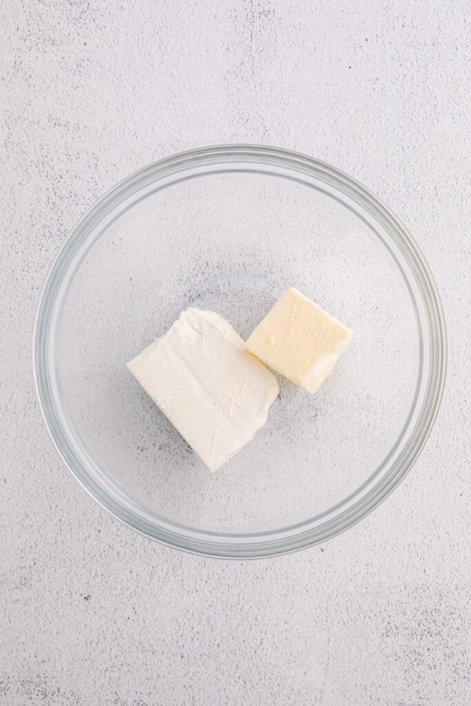 Glass bowl with softened cream cheese and butter