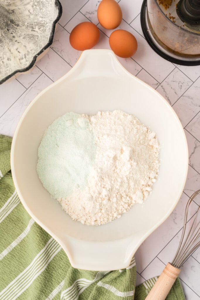 dry cake mix and pistachio pudding mix combined in a mixing bowl