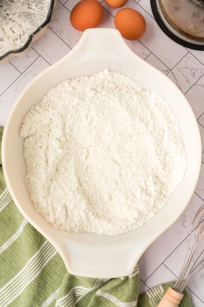 mixed dry ingredients fully blended in a white mixing bowl