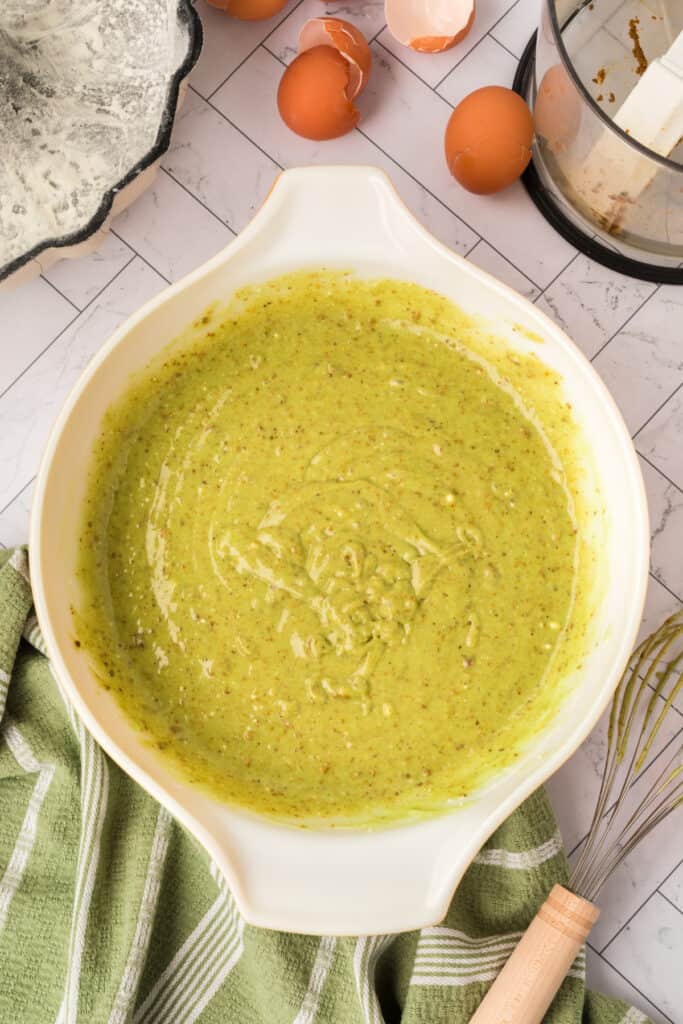 pistachio cake batter mixed until smooth in a bowl