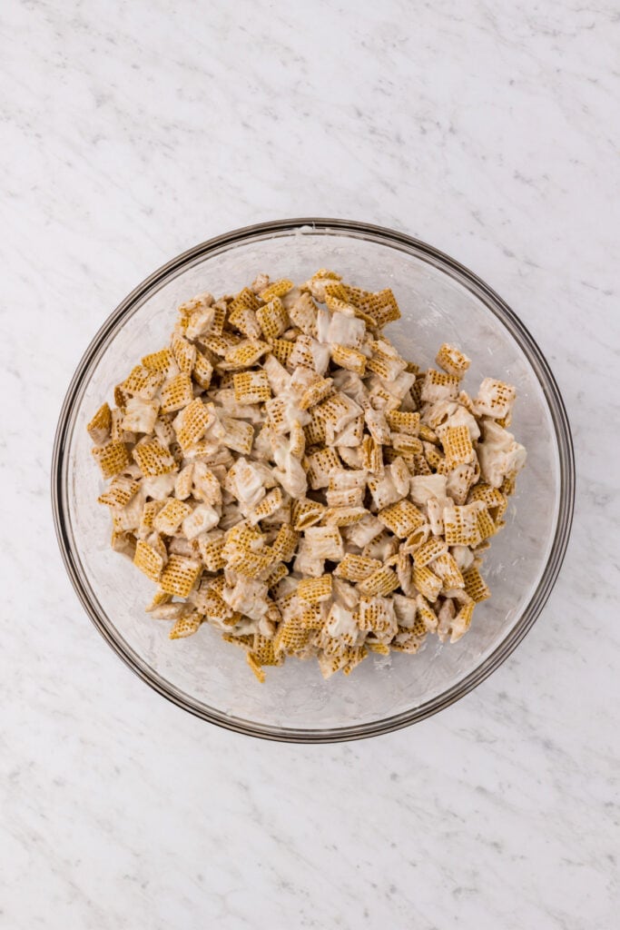 cereal coated in melted white chocolate in a large bowl