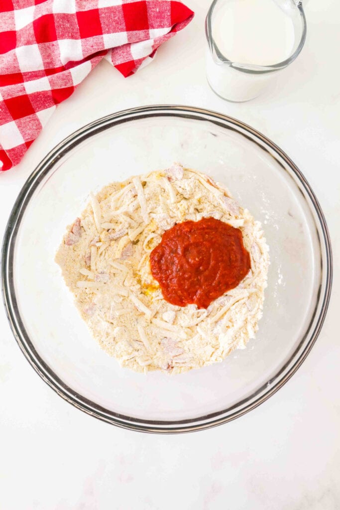 pizza sauce added to the batter mixture in the bowl