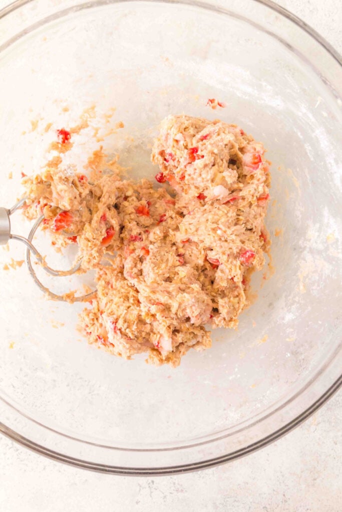 mixed strawberry banana dog treat dough with visible oats and strawberry pieces