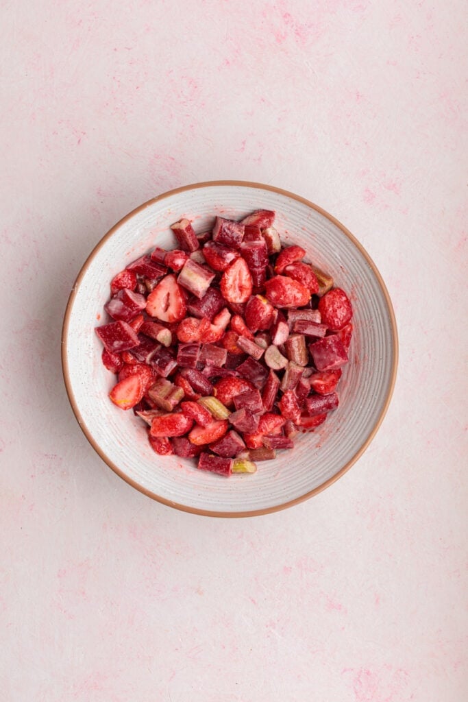 strawberry and rhubarb filling fully mixed and coated in juices in a bowl