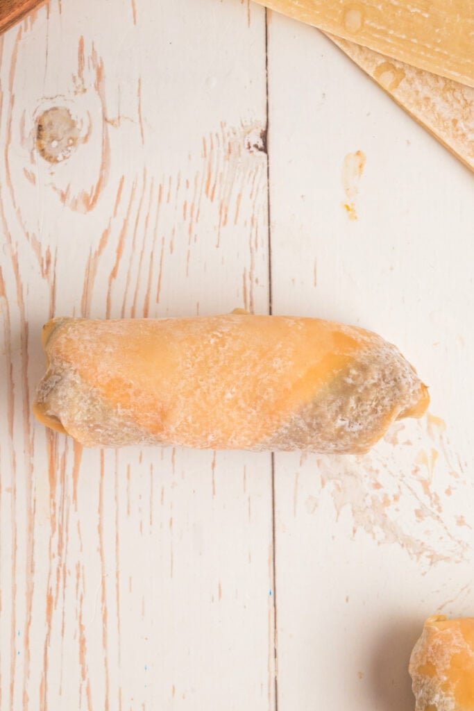 uncooked Big Mac Egg Roll placed on surface before frying